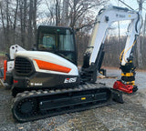 Nice Bobcat E85 mini excavator with our Mecanil saw attachment installed on an Engcon grapple